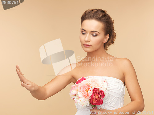 Image of bride with wedding or engagement ring