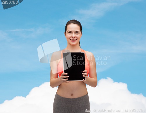 Image of sporty woman with tablet pc blank screen