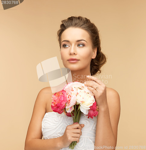 Image of woman with bouquet of flowers