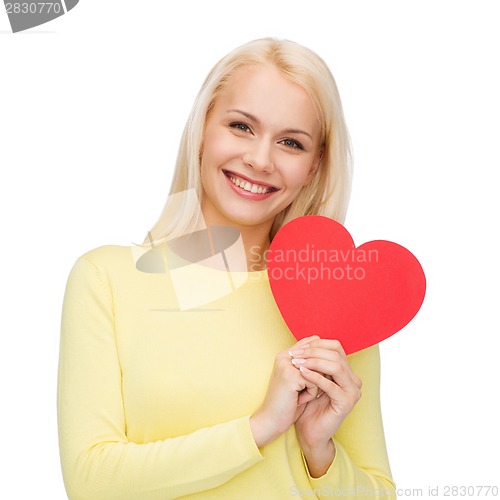 Image of smiling woman with red heart