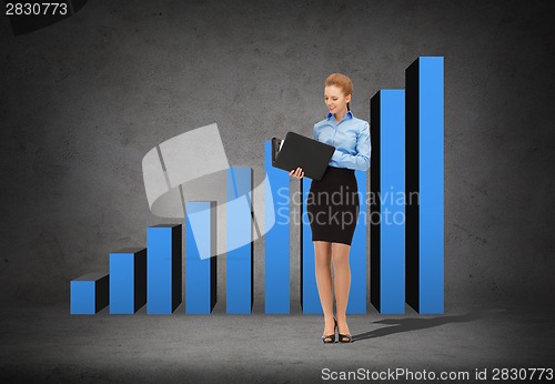 Image of smiling businesswoman with folder