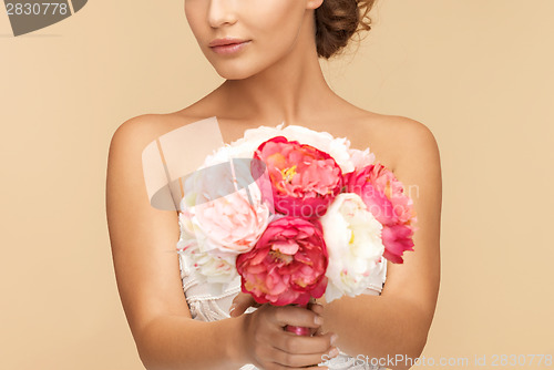 Image of woman with bouquet of flowers