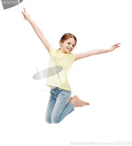 Image of smiling little girl jumping