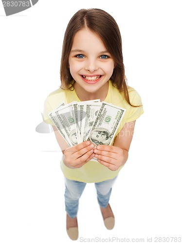 Image of smiling little girl with dollar cash money