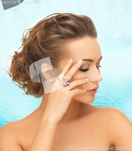 Image of woman with purple cocktail ring