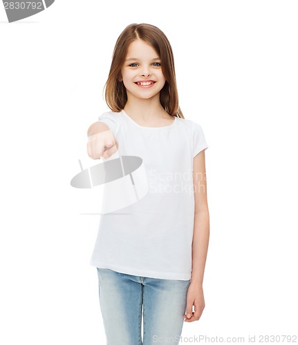 Image of little girl in blank white t-shirt pointing at you