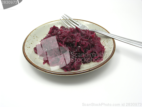 Image of Cooked red cabbage arranged on a plate with fork