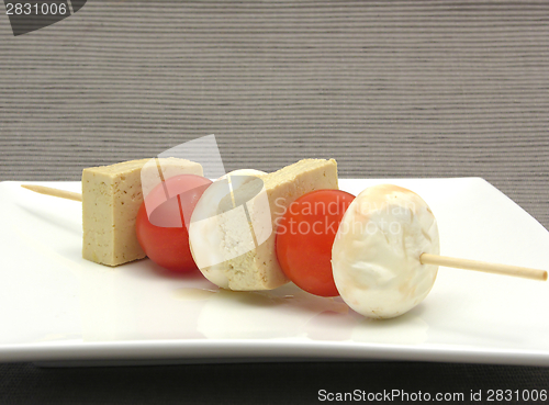 Image of Vegetable spit with bean curd and rice on white plate