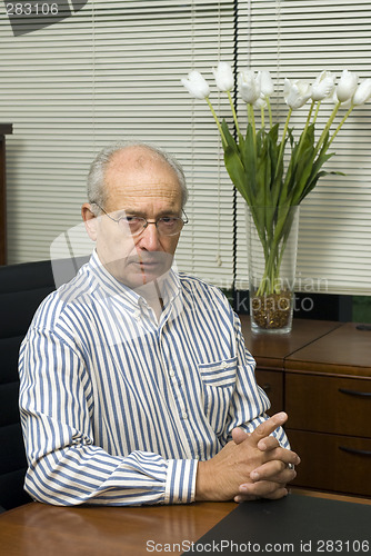 Image of senior executive in office