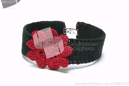 Image of Black crocheted collar with one red crocheted flower