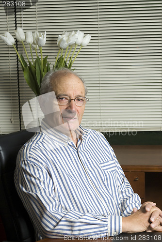 Image of senior executive in office