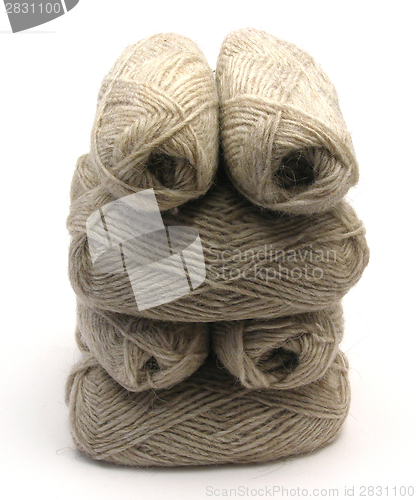Image of Gray new wool lying upon another on white background