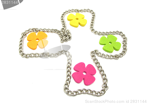 Image of Flowers of felt in a metal cross