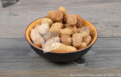 Image of Peanuts on wood