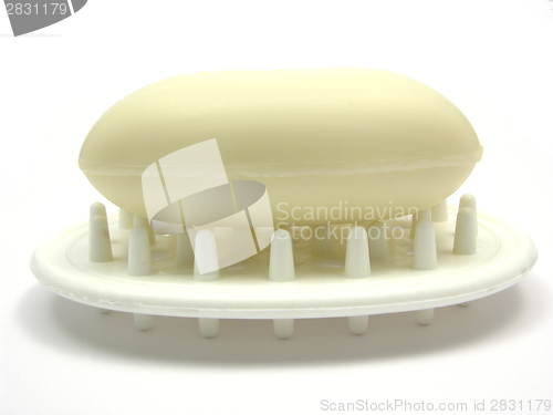 Image of Beige soap on a soap dish on white background