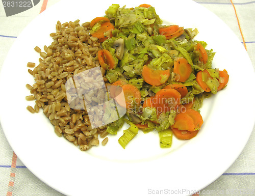 Image of Dish made of cooked bulgur wheat groats, carrots and leek