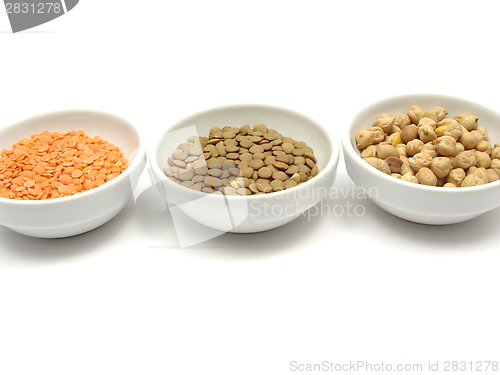 Image of Three bowls of chinaware with garbanzos lentils and red lentils