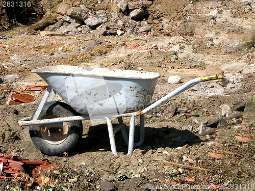 Image of Cutout with a hand barrow on a site