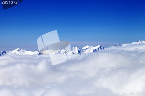 Image of Cloudy mountains at nice winter day