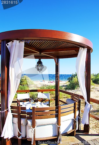 Image of terrace lounge with pergola at  beach