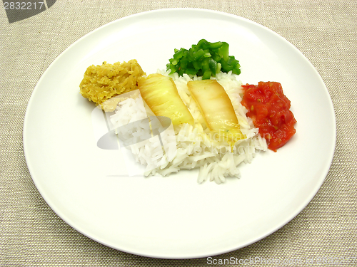 Image of Rice dish with vegetable, lentils and dips