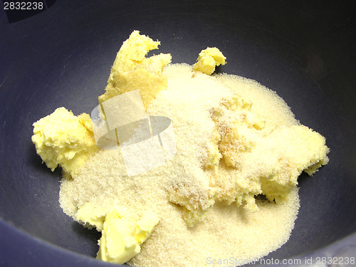 Image of Pieces of margarine and cane sugar in a blue bowl