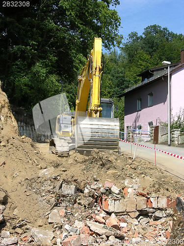 Image of Yellow digger working on a site