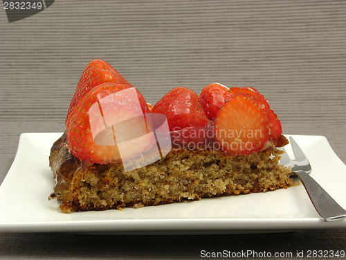 Image of One slice of strawberry cake on white plate on gray background