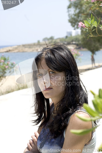 Image of attractive young woman in cafe