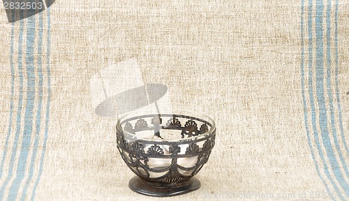 Image of Bowl of glass on linen sheet