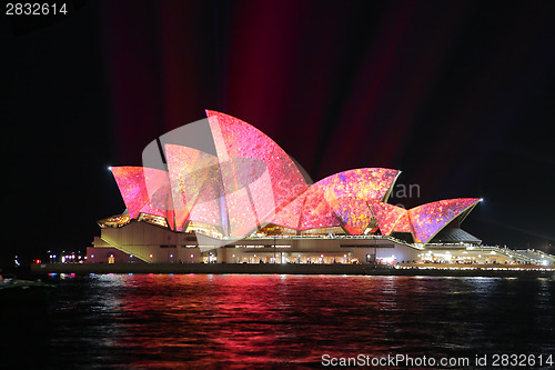 Image of Sydney Opera House in vibrant pink yellow colours