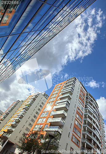 Image of 	modern apartments with a blue sky