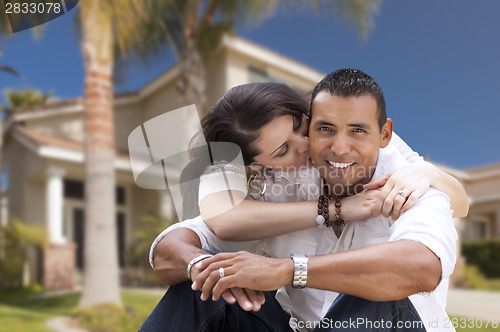 Image of Happy Hispanic Young Couple in Front of Their New Home