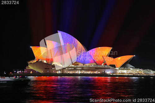 Image of Sydney Opera House in Orange and Purple colours for Vivid