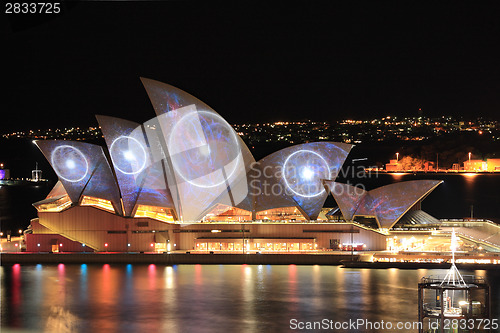 Image of Sydney Opera House with space and swiring imagery during Vivid S