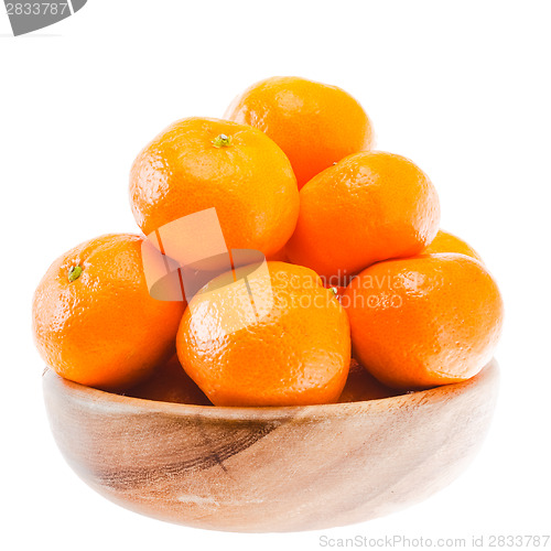 Image of Tasty Sweet Tangerine Orange Mandarin Fruit in wooden bowl 