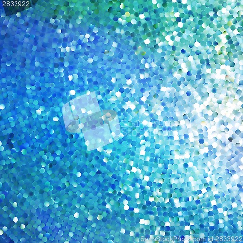 Image of Glitters on a soft blurred background. EPS 10