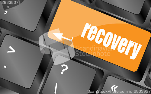 Image of key with recovery text on laptop keyboard button