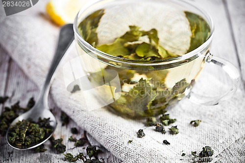 Image of cup of green tea and lemon