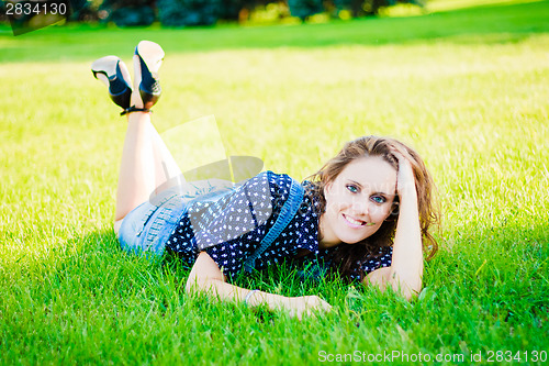 Image of Beautiful young woman on the meadow