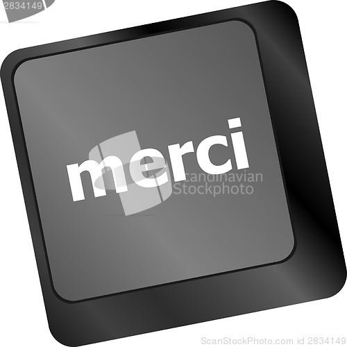 Image of thank you (merci) word on computer keyboard key