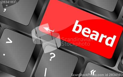 Image of beard word on keyboard key, notebook computer button