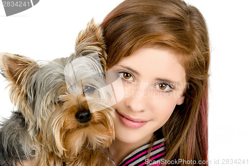 Image of smiling young girl with her pet yorkshire