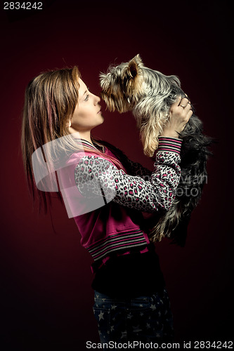 Image of smiling young girl with her pet yorkshire