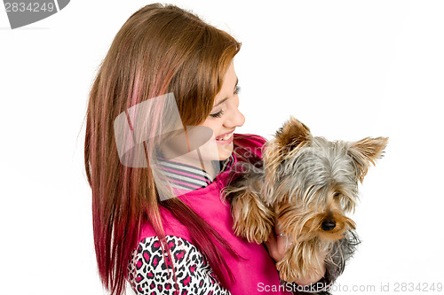 Image of smiling young girl with her pet yorkshire