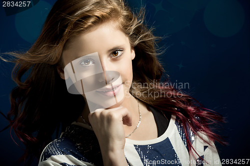 Image of Studio portrait of young beautiful girl