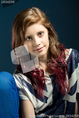 Image of sitting fashion portrait of young beautiful girl