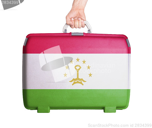 Image of Used plastic suitcase with stains and scratches