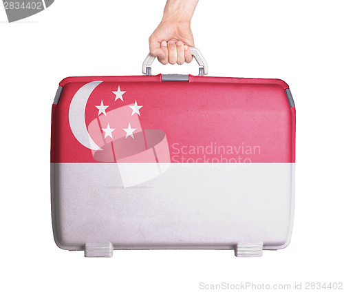 Image of Used plastic suitcase with stains and scratches