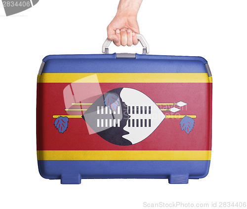 Image of Used plastic suitcase with stains and scratches